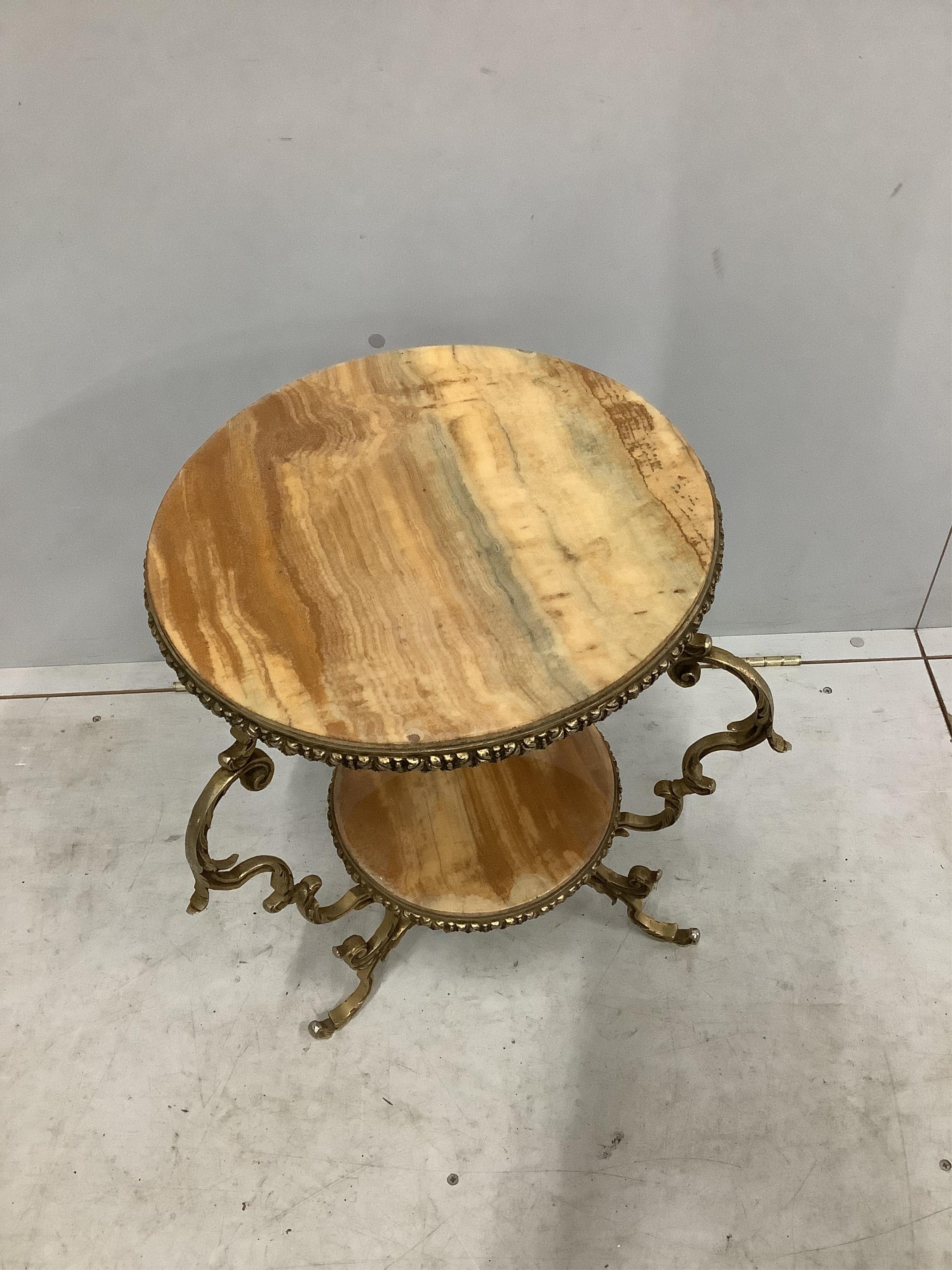 A gilt metal and onyx two tier occasional table, diameter 48cm, height 55cm. Condition - fair